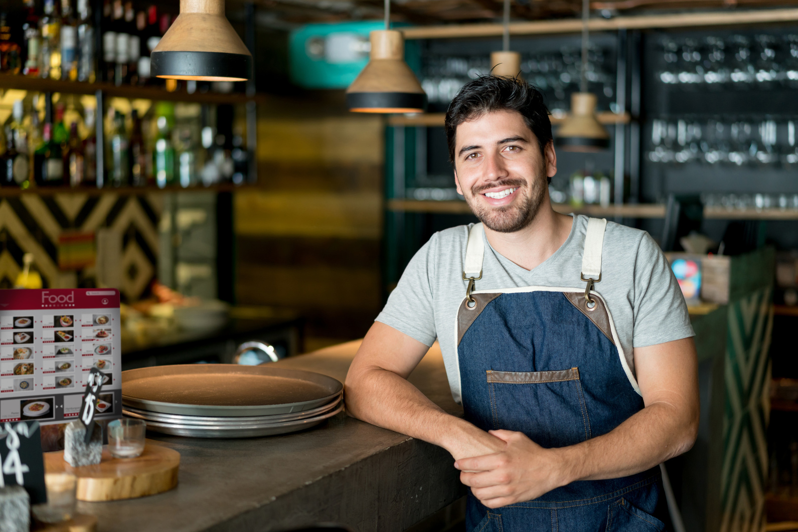 Happy business owner working at a restaurant